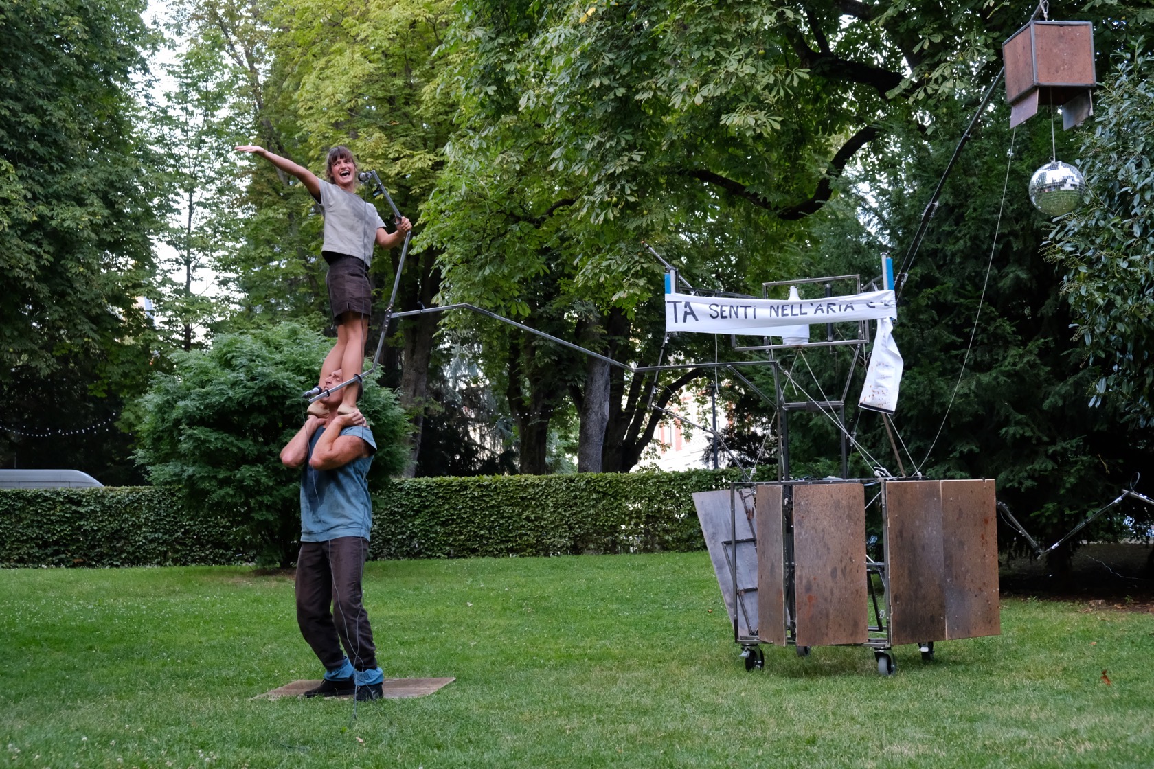 Performing artists in a park with a cabaret
